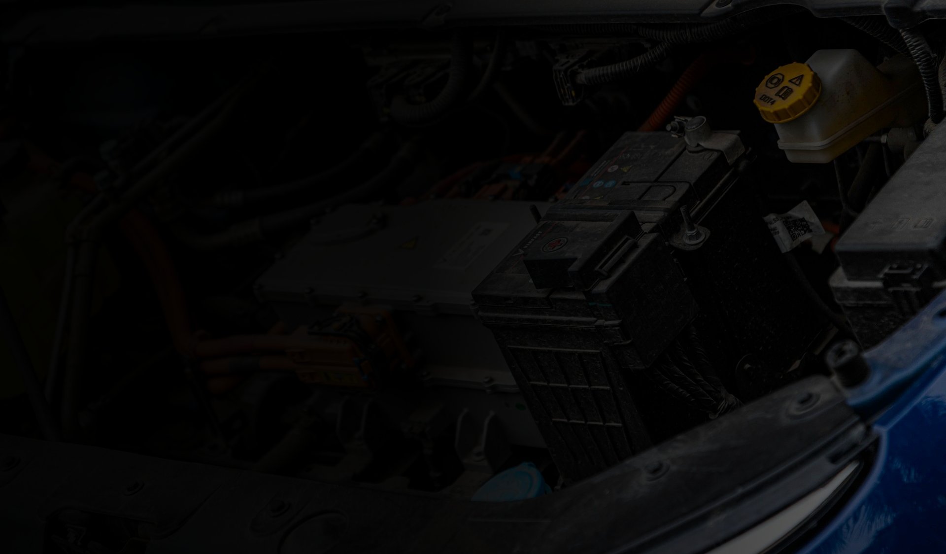 Automotive engine bay with battery