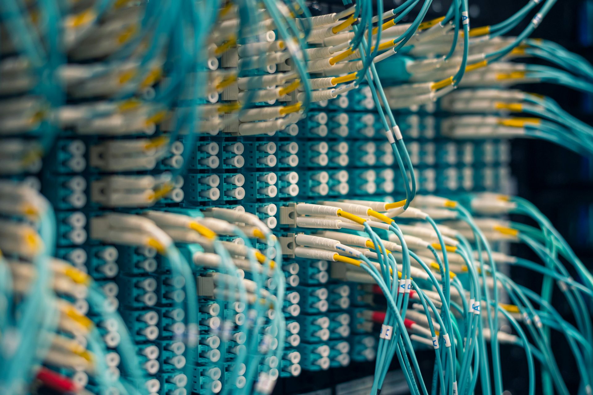 Server cabinets and structured cabling in a data-centre aisle
