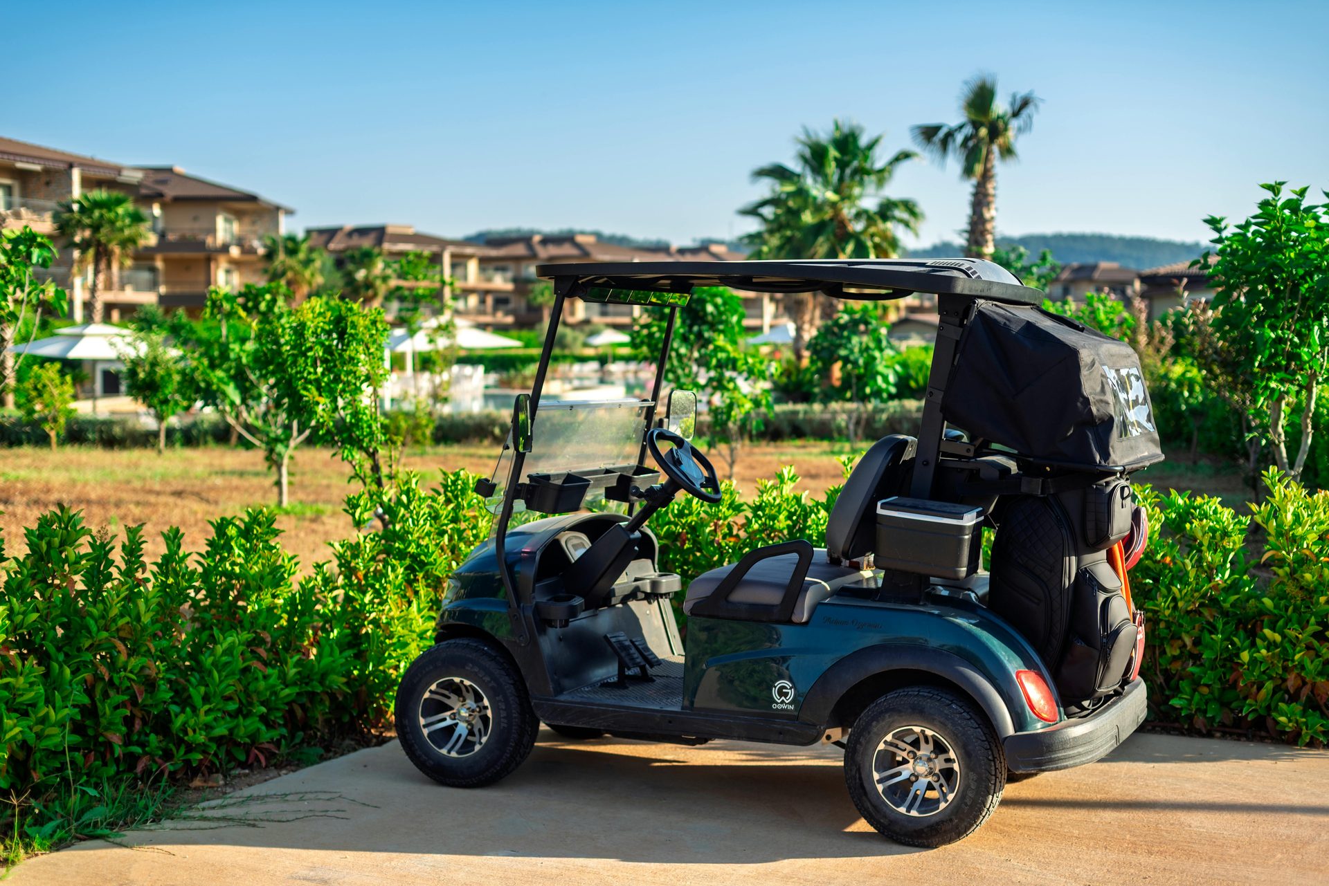 Golf cart on resort pathway